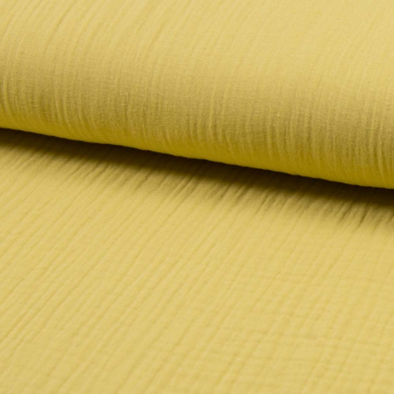 Muslintyg soft yellow